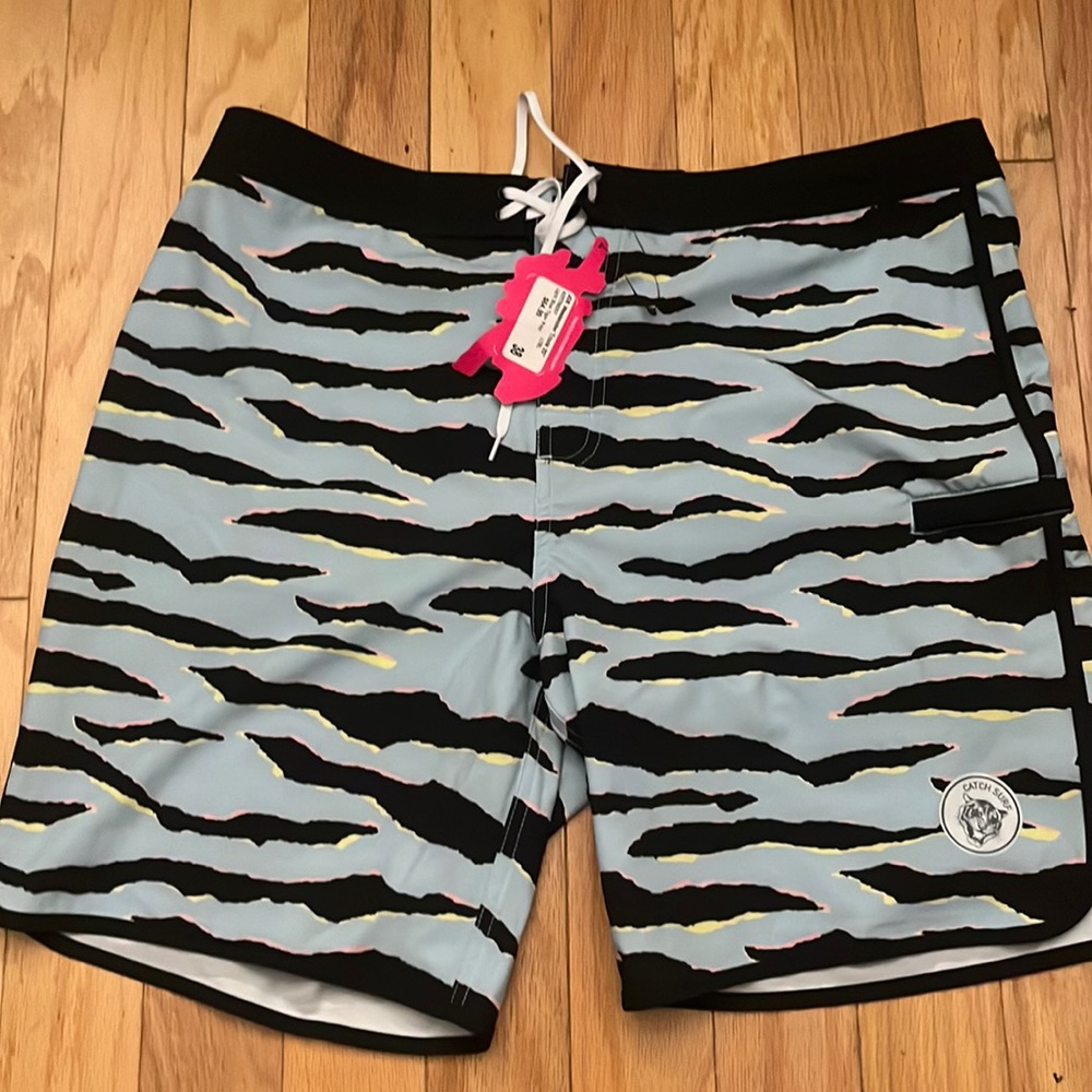 NWT Men’s “Catch Surf JOB Weekender Trunk 20”. Light Blue Tiger Print.